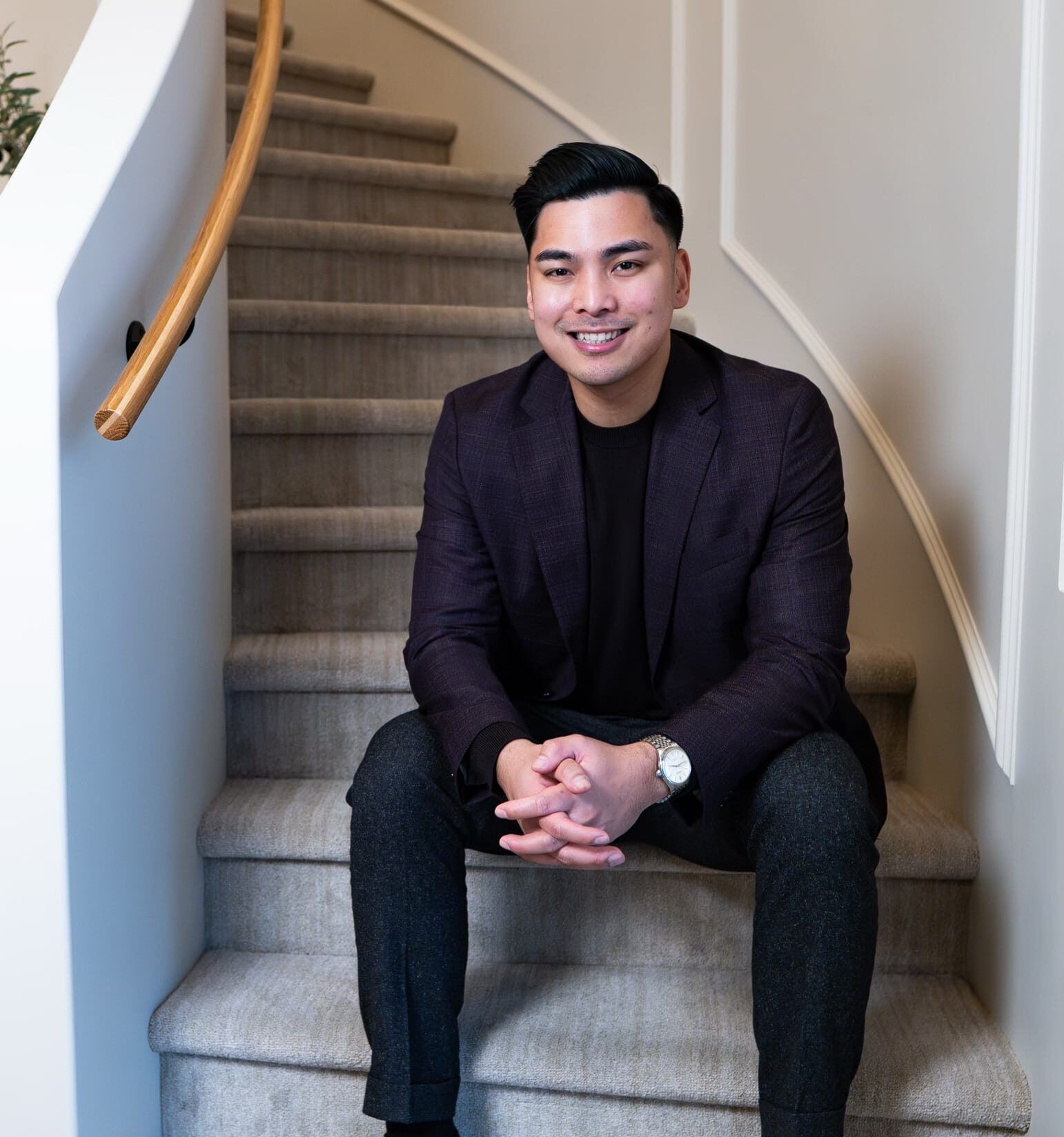 Mikee Headshot Stairs e1770582906354